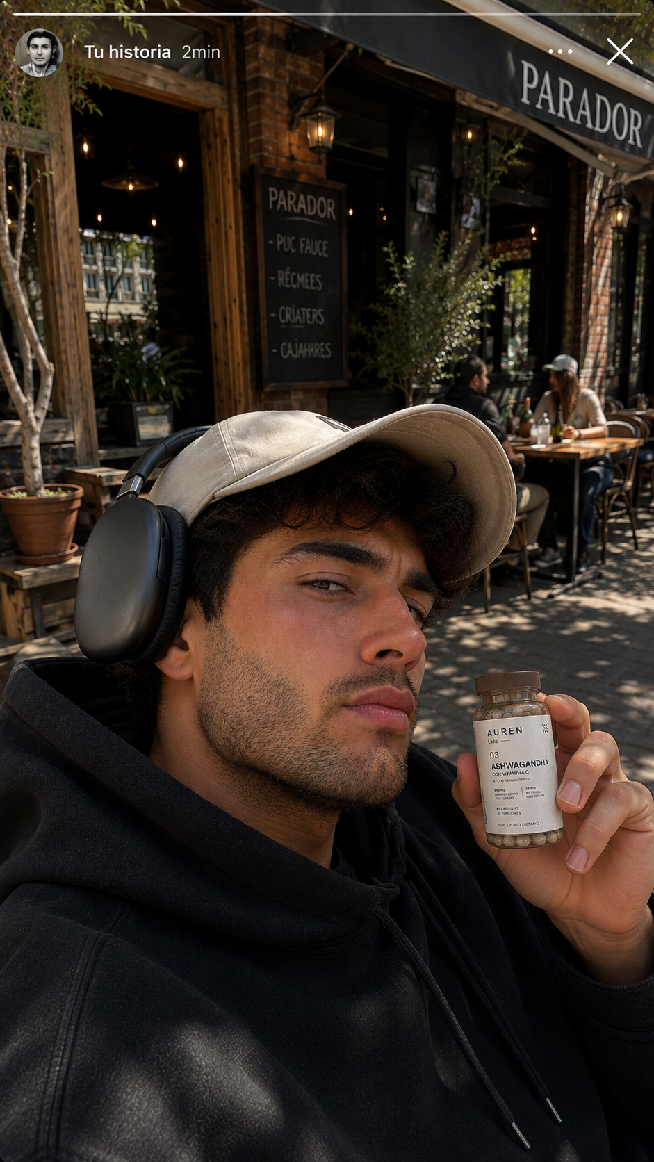 AUREN customer holding Ashwagandha outside a cafe